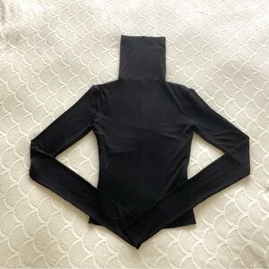 Tank air, turtleneck top.